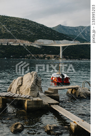 Boats in the Adriatic sea near Dubrovnik city on a sunset. Travel destination in Croatia. Boats in the Adriatic sea near Dubrovnik city on a sunset. Travel destination in Croatia. 138995203