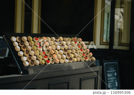 Colorful Choux cakes in a Parisian cafe. French pastries. Colorful Choux cakes in a Parisian cafe. French pastries. 138995306