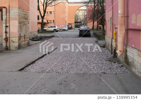 Freshly repaired driveway with scenic archway and city life details 138995354