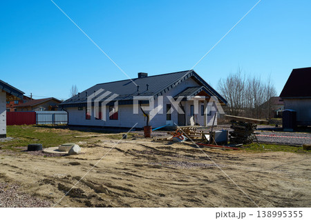 Underway construction of suburban home with upcoming yard development Underway construction of suburban home with upcoming yard development 138995355