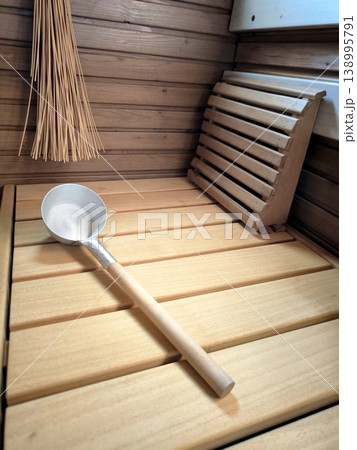 Wooden sauna interior with ladle and headrest Wooden sauna interior with ladle and headrest 138995791