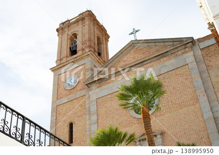 Historic church bell tower and facade in Altea, Spain, a popular destination for travel and tourism during family holidays 138995950