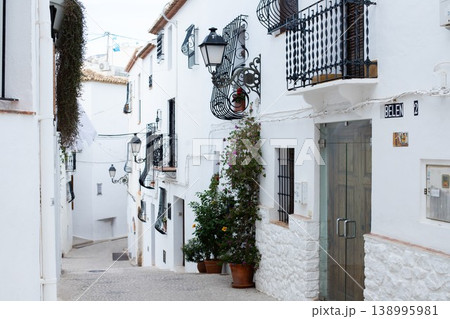 Exploring the charming narrow streets of Altea, Spain, a perfect setting for family holidays and vacation memories Exploring the charming narrow streets of Altea, Spain, a perfect setting for family holidays and vacation memories 138995981