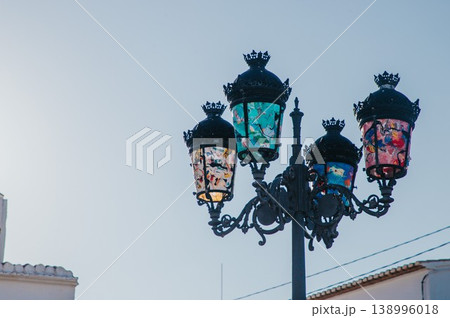 Beautiful decorative street lamp featuring unique multicolored glass designs adorning a charming street in Altea Spain a perfect setting for family holidays and tourism Beautiful decorative street lamp featuring unique multicolored glass designs adorning a charming street in Altea Spain a perfect setting for family holidays and tourism 138996018