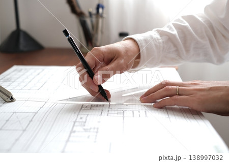 建築図面を製図する日本人建築士の手元 A Japanese architect drawing 建築図面を製図する日本人建築士の手元 A Japanese architect drawing 138997032