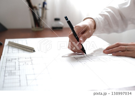 建築図面を製図する日本人建築士の手元 A Japanese architect drawing 建築図面を製図する日本人建築士の手元 A Japanese architect drawing 138997034