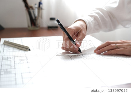 建築図面を製図する日本人建築士の手元 A Japanese architect drawing 建築図面を製図する日本人建築士の手元 A Japanese architect drawing 138997035