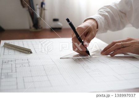 建築図面を製図する日本人建築士の手元 A Japanese architect drawing 建築図面を製図する日本人建築士の手元 A Japanese architect drawing 138997037