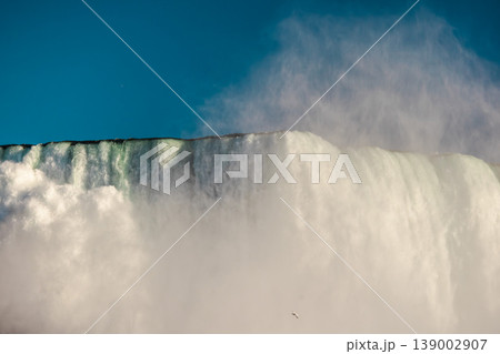 Powerful Niagara Falls waterfall close up with mist and massive water flow 139002907