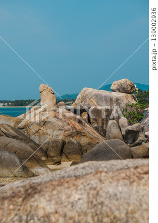 Famous Hin Ta Grandfather Rock formation on Koh Samui with distinctive granite shapes above tropical sea and distant coastline near Lamai beach Famous Hin Ta Grandfather Rock formation on Koh Samui with distinctive granite shapes above tropical sea and distant coastline near Lamai beach 139002936