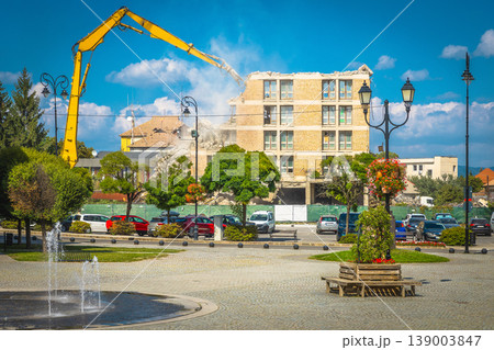 Demolition of the old ruined building using building hydraulic shears 139003847