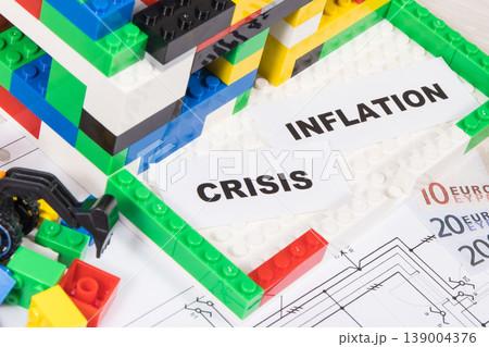 House under construction made of toy blocks, money, housing plan, inscription crisis and inflation 139004376