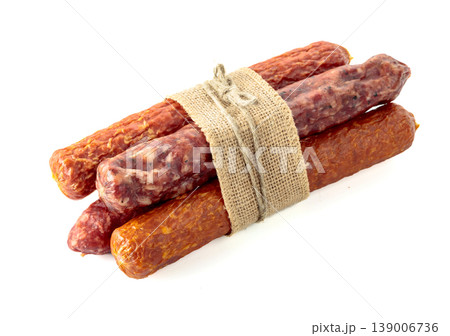 Dry cured sausages isolated on white. Dry cured sausages isolated on white. 139006736
