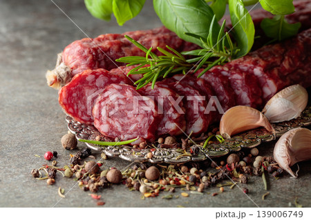 Sliced smoked sausage on a small silver tray. Sliced smoked sausage on a small silver tray. 139006749