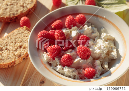 Ricotta or cottage cheese with fresh raspberries. 139006751