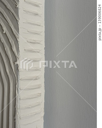 Textured plaster wall with rough unfinished finish perfect as versatile background for design projects 139006824