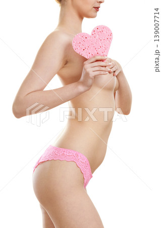 Sensual naked woman with beautiful figure perfect skin holding pink heart shaped bath sponge in hands 139007714