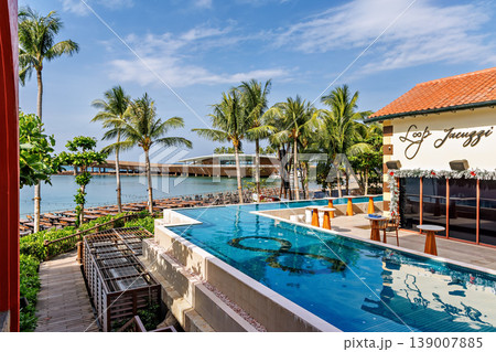 Phu Quoc, Vietnam - January 3 2026: Tropical Resort Poolside View with Palm Trees 139007885