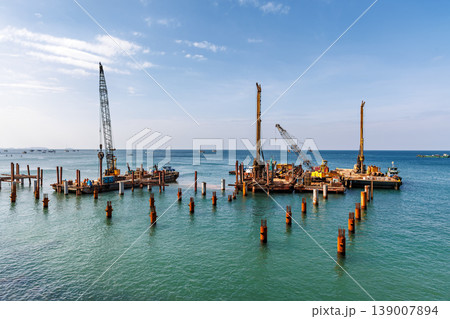Phu Quoc, Vietnam - January 3 2026: Marine Construction Barges and Pile Driving at Sea Phu Quoc, Vietnam - January 3 2026: Marine Construction Barges and Pile Driving at Sea 139007894