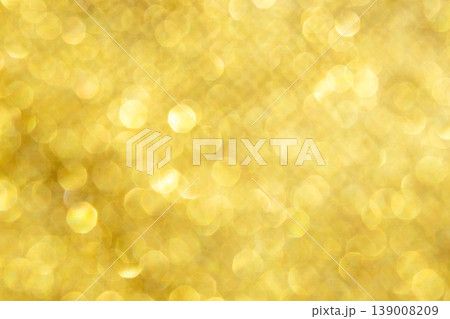 Soft gold bokeh background with warm sparkling glitter and festive light highlights 139008209