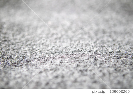 Close-up of grey carpet texture with dust, lint and pet hair in home interior 139008269