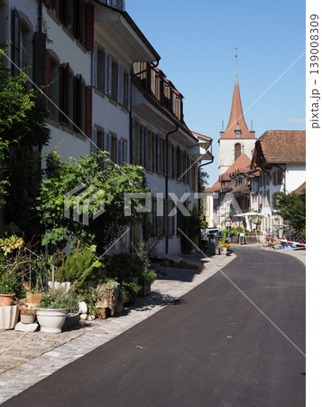 Alley with German church in town of Murten in Switzerland - vertical 139008309