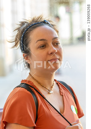 Adult woman portrait represents natural emotions personality and social interaction in urban environment Adult woman portrait represents natural emotions personality and social interaction in urban environment 139009268