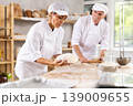 Man and woman, experienced bakers, prepare dough for baguettes and croissants together in private bakery 139009655