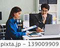 Millennial Asian stressed depressed worried thoughtful professional male businessman female businesswoman employee staff in formal business suit sitting thinking solving problem ideas in office room 139009909