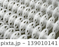 White plastic rollers of industrial conveyor, production, sorting, or transportation line 139010141