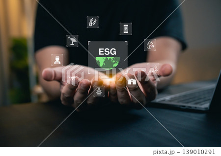 Hands Holding Symbols of Environmental, Social, and Governance Concepts with ESG Logo and Icons Representing Sustainability and Responsibility Hands Holding Symbols of Environmental, Social, and Governance Concepts with ESG Logo and Icons Representing Sustainability and Responsibility 139010291