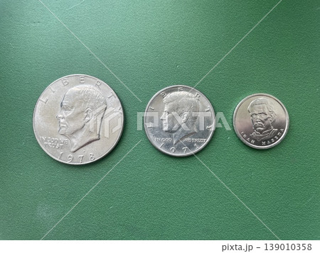 Eisenhower dollar coin compared with kennedy half and ukrainian hryvnia Eisenhower dollar coin compared with kennedy half and ukrainian hryvnia 139010358
