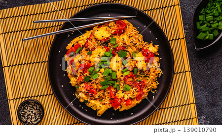 Korean style instant noodle, Shin Ramyeon with tomatoes and scrambled eggs. Korean style instant noodle, Shin Ramyeon with tomatoes and scrambled eggs. 139010790