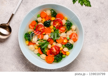Soup with mini dumplings and vegetables. Soup with mini dumplings and vegetables. 139010799