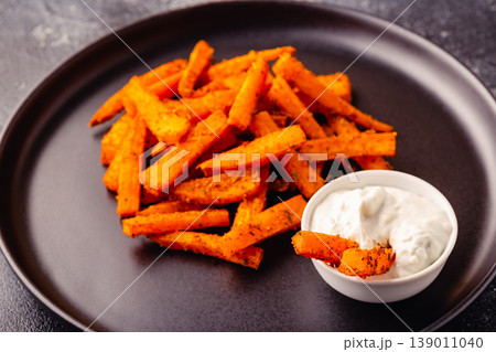 Sweet potato fries with blue cheese sauce. Sweet potato fries with blue cheese sauce. 139011040