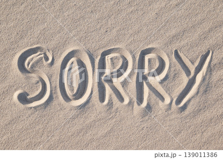 Word Sorry written on sand, close up. Concept of apologising and sorrowful mood 139011386
