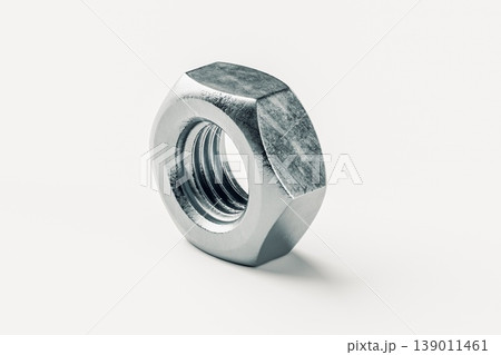 Close-Up of a Metallic Nut on a Light Background Close-Up of a Metallic Nut on a Light Background 139011461