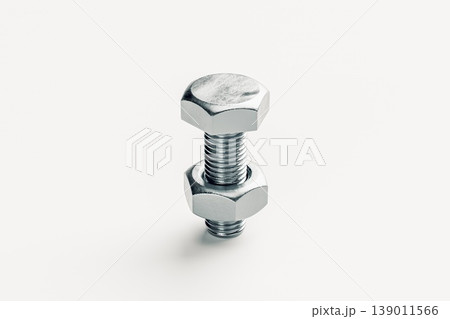 Close-Up of a Silver Bolt and Nut on a Light Background Close-Up of a Silver Bolt and Nut on a Light Background 139011566