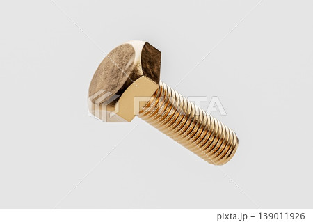 Close-up of a Gold Bolt on a White Background Close-up of a Gold Bolt on a White Background 139011926