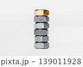 Stack of Metallic Nuts with One Gold Nut on Top 139011928