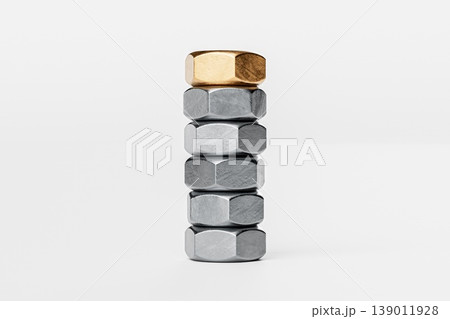 Stack of Metallic Nuts with One Gold Nut on Top Stack of Metallic Nuts with One Gold Nut on Top 139011928