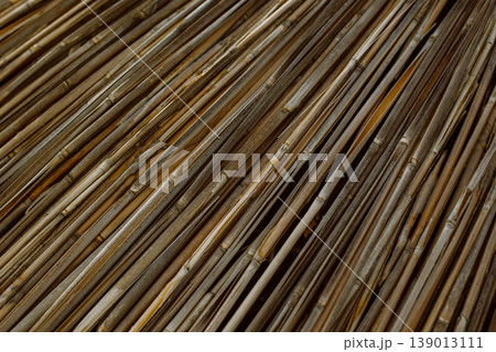 Dry reeds or bamboo texture. Natural background. Dry reeds or bamboo texture. Natural background. 139013111