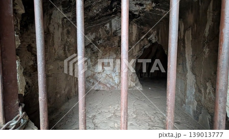 Cave seen through the iron fence 139013777