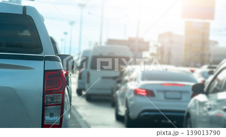 Rear side view of pickup car driving on the road of Thailand. Heavy traffic congestion in major cities during bright daylight hours. 139013790
