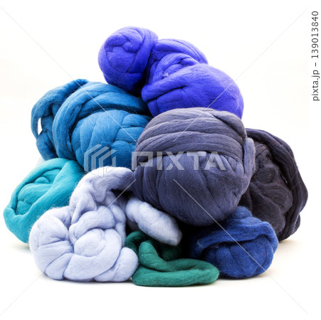 Multicolored skeins of merino wool on a white background 139013840