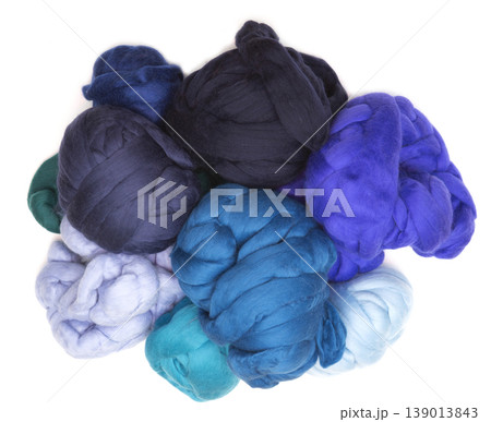 Multicolored skeins of merino wool on a white background 139013843