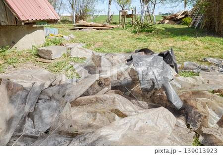 Old, torn plastic bags on the ground, hazardous waste. Old, torn plastic bags on the ground, hazardous waste. 139013923