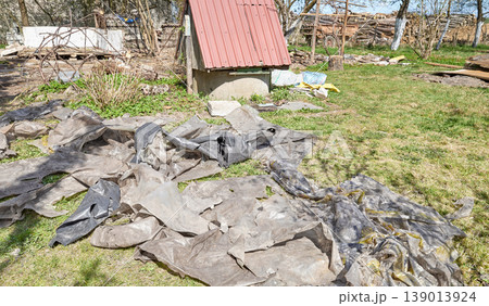 Old, torn plastic bags on the ground, hazardous waste. Old, torn plastic bags on the ground, hazardous waste. 139013924