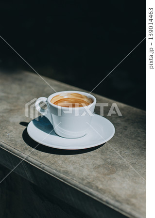 Cup of black coffee in a street cafe. Cup of black coffee in a street cafe. 139014463