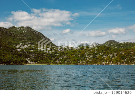 Amazing view of Skadar Lake and beautiful mountains on a sunny morning. Amazing view of Skadar Lake and beautiful mountains on a sunny morning. 139014620